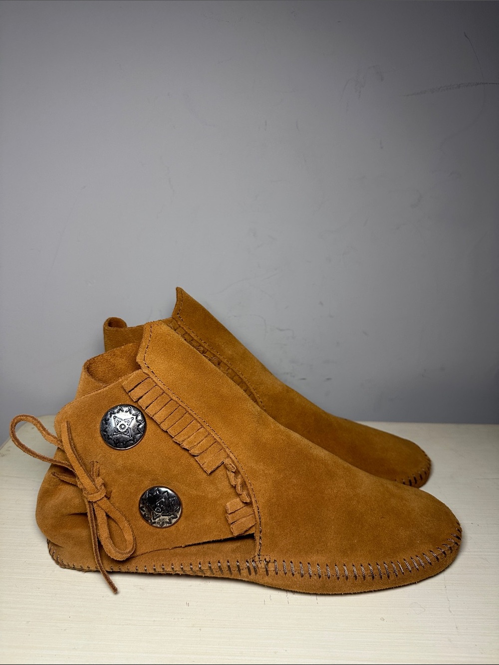 Minnetonka Suede Fringe Ankle Moccasin Boots in Cognac with silver